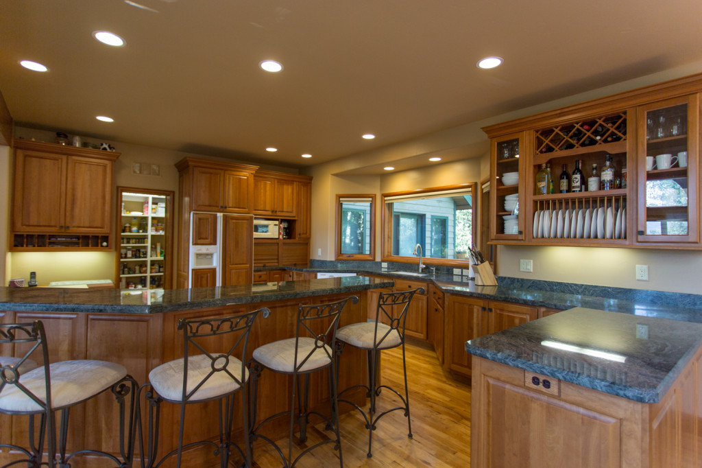 Granite countertops, island seating and walk-in pantry.